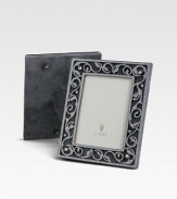 A stunning gift or keepsake made only for the most treasured photographs, crusted with faceted Swarovski crystals and freshwater pearls. Arrives in a gift box Accommodates a 4 X 6 photograph Overall: 6½ X 8½ Imported 