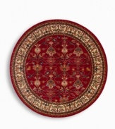 A larger-diameter round that is ideal for oversized rooms. In homage to renowned artist William Morris, this rug features his signature vine and pomegranate motifs framed by an acanthus leaf border inspired by a Morris & Co. tapestry. A special dyeing process imparts subtle shadings to a dynamic palette of blues, greens, terra cotta, saffron yellow and ivory tones on a warm red ground. The resulting striated effect recreates the depth of hue achieved by aged vegetable dyes. Woven of premium worsted wool and finished with a patented luster wash for indulgent softness.