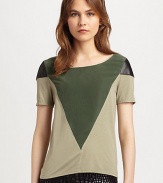 Geometric panels of silk and leather define this lightweight, colorblocked top. BoatneckLeather-trimmed shouldersShort sleevesBody: 60% viscose/25% nylon/15% angora; Contrast: SilkDry clean with leather specialistMade in USA of imported fabricModel shown is 5'9½ (176cm) wearing US size Small.