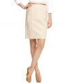 Infusing style into workwear staples, a faux python & bamboo attached belt adds a touch of luxe to this Calvin Klein pencil skirt!
