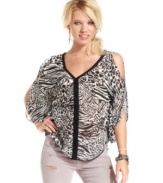 Answer the call of the wild in this chiffon, animal-print top that sports trend-right cutouts and bold attitude! From GUESS?.