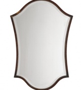 Gracefully shaped with a thin metal frame with twisted-rope detail and beveled reflective surface, the Abra vanity mirror by Uttermost has a quiet yet regal presence, ideal for dressing rooms or anywhere you want to introduce a touch of feminine elegance.