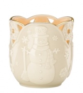 Carved snowflakes flurry around a cheerful snowman in smooth porcelain upon this Merry Lights Snowman votive holder from Lenox. A gold scalloped trim coordinates this home accent with any favorite Lenox fine dinnerware or giftware.