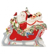 Make way for the sleigh! This holiday napkin holder from Fitz and Floyd adds instant cheer to ordinary essentials, sandwiching a stack of napkins or your favorite Christmas cards between Santa and winter scenery.