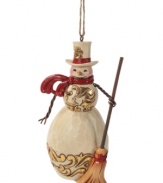 A classic snowman, complete with a carrot nose and two eyes made out of (what looks like) coal, this charming Jim Shore ornament will stay cool season after season.