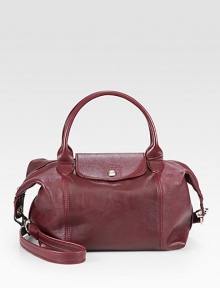 A classic iconic style, now in luxurious leather with a versatile strap.Double top handles, 4¼ dropDetachable shoulder strap, 19½ dropTop zip closure with snap flapOne inside zip pocketTwo inside open pocketsFully lined9¾W X 9H X 6¼DImported