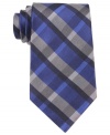 Need a simple solution for your wardrobe of solids? Suit up with this plaid tie from Calvin Klein.