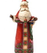 From gift-giver to decorator, Old Saint Nick does it all! A folk rendition of the classic red suit adorns this thoughtful Santa as he gets ready to add a touch of cheer to your winter wonderland.