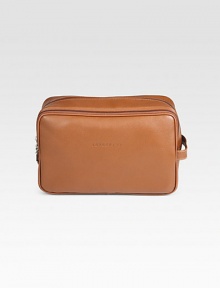 Whether you're traveling near or far, keep all of your essentials neatly packed in this suitcase essential.Zip closureSide handleFully linedLeather11W x 7H x 5DImported Whether you're traveling near or far, keep all of your essentials neatly packed in this suitcase essential.Zip closureSide handleFully linedLeather11W x 7H x 5DImported