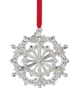 Dream of a silver Christmas. Crafted in lustrous silver plate, the 2012 Snow Majesty snowflake ornament features twinkling crystal gems and a dated tag to commemorate this year's celebration.