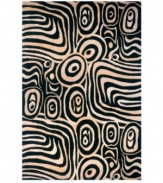 As elegant as it is exotic, this design evokes imagery of a sun swept African safari. In fact, this rug draws its inspiration from the most important art movements of the 20th-century. Both classically beautiful and decidedly modern, hints of 1910's Vienna Secession, 1930's Art Deco and 1950's Abstract Expressionism can be found in this rug's wild swirling lines of black and off-white. Meticulously hand-tufted and hand-carved of pure wool.