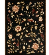 An intricate display of cascading florals creates this purely elegant Lyndhurst area rug from Safavieh. Crafted in Turkey of soft polypropylene, this rug radiates timeless allure with the added convenience of easy-care construction. (Clearance)