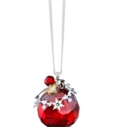 All-around brilliant. The Light Siam Satin ball ornament sparkles in faceted Swarovski crystal with elaborate silvertone accents. Delicate, dangling charms – including a real metal bell – add extra dazzle.