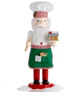 Inspiring all kinds of magic in the kitchen, the Chef Santa nutcracker dons a hat and apron trimmed in candy stripes. A miniature gingerbread house and wooden baking tools add to his merriment.
