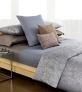 Modern sophistication rooted in natural splendor. Calvin Klein's Cayman comforter set is elegantly artistic with an abstract painted leaf design in shades of charcoal over a hyacinth background. Reverses to self.