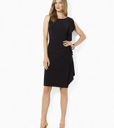 Rendered in slinky matte jersey for an exquisite drape, this refined dress channels modern glamour with a bateau neckline and a soft cascade of ruffles at the side.