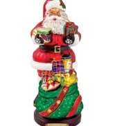 Up to his beard in gifts, the Toy Santa figurine is the essence of holiday cheer. Handcrafted glass is brilliantly painted with glittering detail in classic Christopher Radko style.