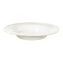 This Vietri bowl was crafted by hand in Tuscany of durable, textural terra cotta for an irresistibly warm appeal. Ornament rolls are used to create its ornate designs.