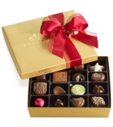 Donned with a soft red bow, this classic collection of Godiva chocolates makes a perfectly sweet and irresistible gift this season in its shimmering gold box.