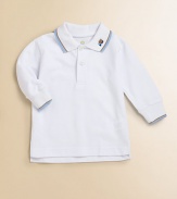 The classic pique cotton polo shirt gets a darling update with contrast trim and dumptruck embroidery.Shirt collarLong sleevesButton frontUneven side vented hemCottonMachine washImported Please note: Number of buttons may vary depending on size ordered. 