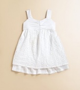 An eyelet overlay and gathered sweetheart neckline make this simple frock simply outstanding.Sweetheart necklineWide strapsBack buttonsEmpire waistFull skirtCottonMachine washMade in USA Please note: Number of buttons may vary depending on size ordered. 