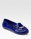 Loafer-inspired silhouette with perforated detailing, topped with a charming goldtone bow. Perforated rubber upperRubber lining and solePadded insoleImportedOUR FIT MODEL RECOMMENDS ordering ½ size up as this style runs small. 