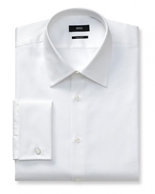 Slightly trimmer than classic fit, button front long-sleeved shirt. Voluminous Kent collar. French cuffs. Flat back yoke with no pleats. Clean front, no pocket. Rounded hem. Textured solid.