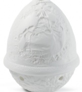 Place a candle inside this immaculate Lladro votive to bring the meticulously handcrafted lithophane to light. Santa Claus appears within a wreath on its lid while mistletoe blooms below.