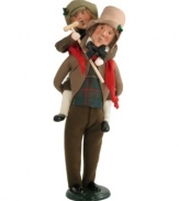 Despite the ever-present Scrooge, Bob Cratchit and son Tiny Tim appear merry and full of spirit in this handcrafted collectible inspired by A Christmas Carol.