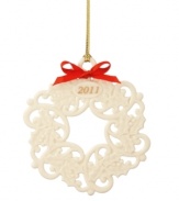 Make it a Christmas to remember with Lenox. A wreath of fine porcelain, this annual ornament is dated for the 2011 holiday season and accented with a festive red bow and gold thread.   Qualifies for Rebate