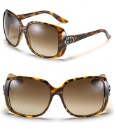 Oversized rectangle sunglasses with signature Gucci logo embellishment at temples.