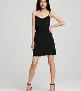 A feminine take on the LBD, this black Aqua dress features all the details that define ladylike style--think dainty buttons, a cinched waistline and a pretty, scallop hem.