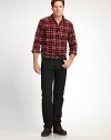 A rugged sport shirt featuring trim, modern proportions, soft cotton twill, and supple dyed goat suede elbow patches.Shirt collarButton-down placketFlap front button pocketsLong sleeves with button cuffsShirttail hemCottonMachine washImported