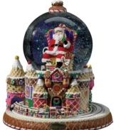 Santa takes center stage in this sugar-coated snow globe from Christopher Radko. A candy cane thrown, peppermint swirls and a cherry on top make it a real holiday treat.