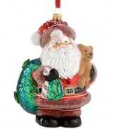 A jolly, happy soul! This mouth-blown glass Santa ornament from Vaillancourt is delicately crafted with gem, beaded and sparkling details for a brilliant addition to any Christmas tree.