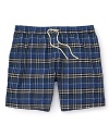Packing for a weekend in paradise? A brighter check print and relaxed fit distinguishes Burberry's lightweight swim trunk.