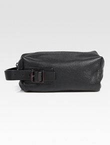 A travelers essential is enhanced by a a tonal side handle with buckle detail, finished in textured leather.Zip closureSide handleFully linedLeather10W x 5¼H x 4½DImported A travelers essential is enhanced by a a tonal side handle with buckle detail, finished in textured leather.Zip closureSide handleFully linedLeather10W x 5¼H x 4½DImported