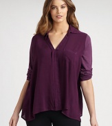 An airy top with raw-edge details that offers a relaxed, boxy fit.V-neckTab sleevesOne front pocketAbout 30 from shoulder to hemRayonHand washMade in USA
