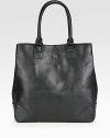 Crafted from ultra-luxe leather, this sleek silhouette is roomy enough for all your essentials.Double top handles, 8 drop Magnetic snap closure Protective metal feet One inside zip pocket Two inside open pockets Cotton lining 13½W X 14H X 3½D Imported