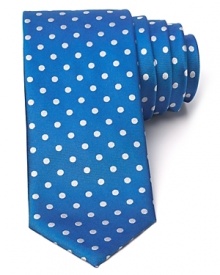 Playful polka dots adorn a classic silk tie from BOSS Black.