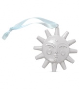 A sunny face amid Santas and snowflakes, this pure white porcelain ornament lends new brilliance to holiday homes. From Jonathan Adler.
