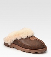 Bomber-inspired suede in a timeless design with shearling lining and a comfy foam sole. Foam heel, 1 (25mm)Suede upperShearling liningFoam solePadded insoleImported