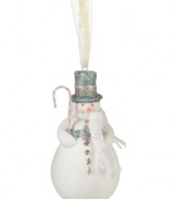 Crafted of pure porcelain bisque, bring some winter cheer to your tree this season with the snowman ornament from Department 56. Features a blue and silver top hat, white knit scarf and festive candy cane accessory.