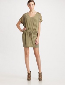 Relaxed, stretch silk blouson style designed with contrasting textures and an unexpected back cutout.Scoop neckline Wide raglan sleeves Drawstring waist Back cutout detail About 19 from natural waist 94% silk/6% spandex Dry clean Imported