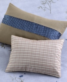 Out of the blue. A deep blue stripe of intriguing honeycomb texture in pure silk embellishes this sophisticated Calvin Klein pillow with luxury. Out of the blue. A deep blue stripe of intriguing honeycomb texture in pure silk embellishes this sophisticated Calvin Klein pillow with luxury.