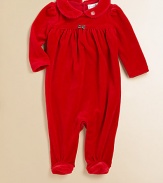 A beautiful long-sleeved footed coverall in plush velour is highlighted with pretty puffed sleeves and an empire waist.Peter Pan collarLong sleevesBack buttonsGathered empire waistBottom snaps80% cotton/20% polyesterMachine washImported Please note: Number of buttons may vary depending on size ordered. 