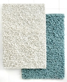 Treat your toes to texture! The Loopi bath rug boasts generous cotton loops that make your steps to and from the shower a dream. Features a latex back. Treat your toes to texture! The Loopi bath rug boasts generous cotton loops that make your steps to and from the shower a dream. Features a latex back.