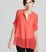 This season, a sheer French Connection top in ravishing red adds a jolt of hue for a bold new you.