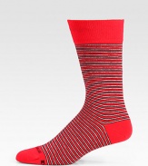 A vibrant stripe pattern is offset by a solid top and heel and shaped in a soft cotton blend.Mid-calf height70% cotton/28% polyester/2% elasticMachine washImported