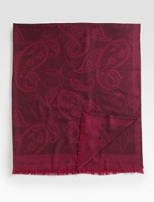 A beautiful appointment at the end of the bed or edge of the sofa, carefully woven in wool with a tonal paisley design and fringed logo edges. 59 X 75 Wool; dry clean Made in Italy 